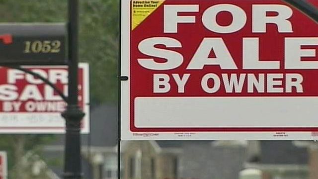 Rolesville homeowners protest with a forest of 'for sale' signs