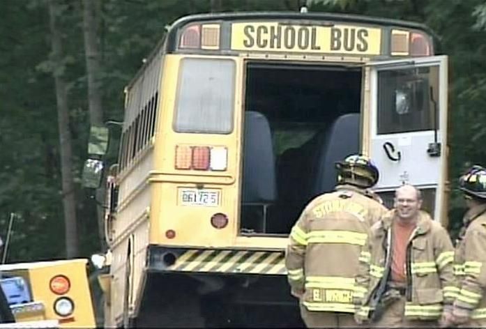Woman charged with DWI after school bus hit