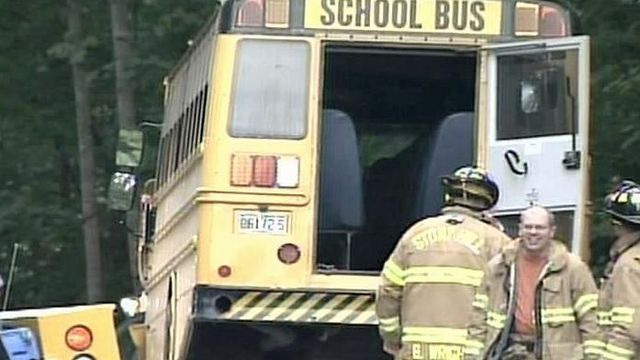 Woman charged with DWI after school bus hit