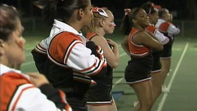 Principal: Cheerleaders show more than spirit in uniforms