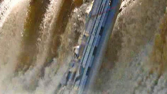 Boat plunges down Tar River dam