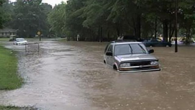 Flooding damages homes, stands motorists