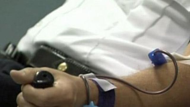 Donors give blood in support of shot officer