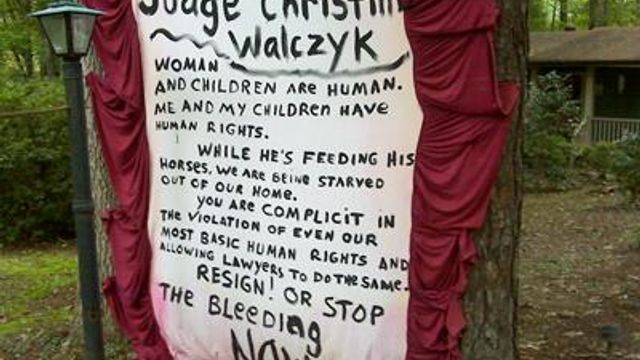 Raleigh woman posts signs against Family Court