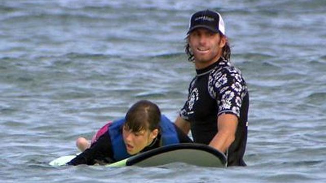 Surfers teach disabled children