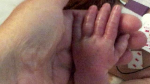 Newborn delivered after fatal wreck not improving, family says