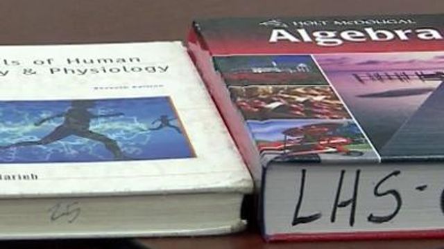 After budget cuts, students unable to take textbooks home