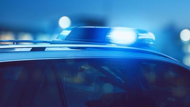 Blue police lights in the dark at a crime scene Blue police lights in the dark at a crime scene