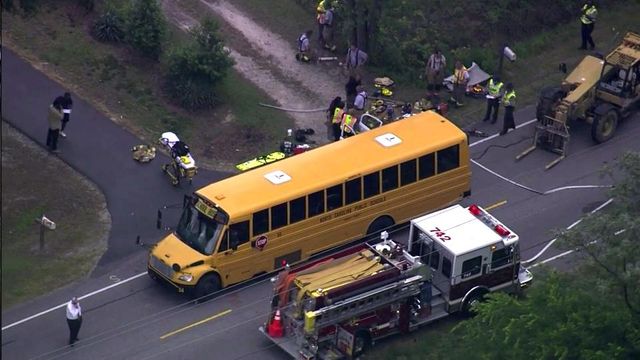 High school teacher dies in crash with school bus