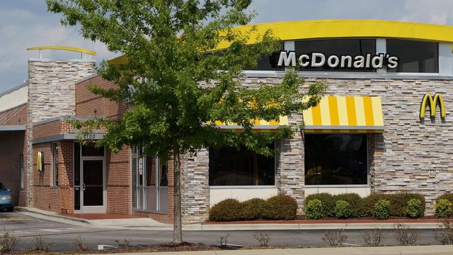 Woman thwarts McDonald's robber, gets shot