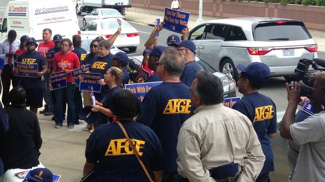 Group protests 'anti-worker policies' outside Durham VA office