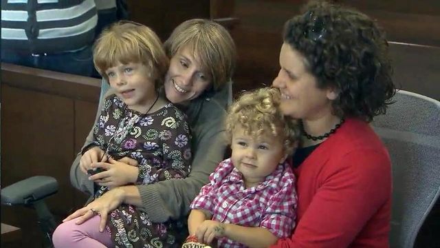 Gay couples shift from marriage battle to adoption