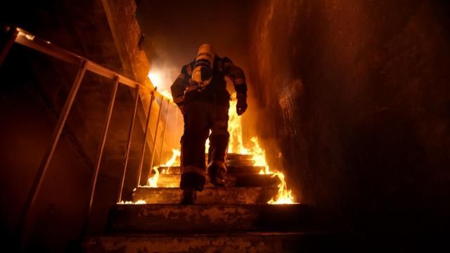 Firefighter in a burning building. (This is a generic photo, not a photo from the scene).