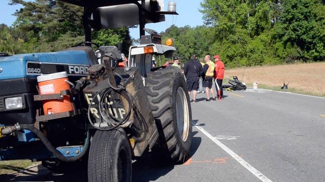 Motorcyclist slams into back of tractor mowing along highway