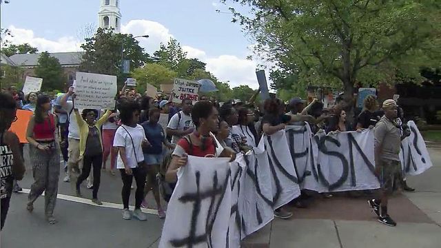 Demonstrators march through Chapel Hill