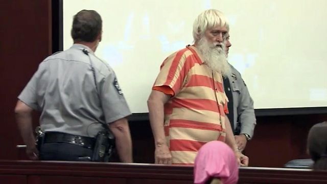 Mall Santa wearing jail jumpsuit instead of red suit