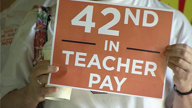 Teachers rally for higher pay