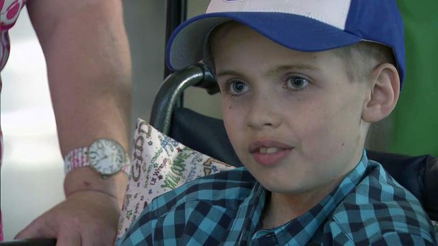 Asheville boy battling cancer gets hero's welcome at RDU