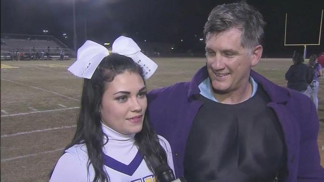 Military dad surprises daughter on senior night at Jack Britt High School
