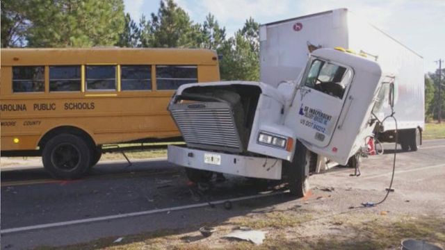 One person taken to UNC Hospitals after school bus and tractor-trailer collision