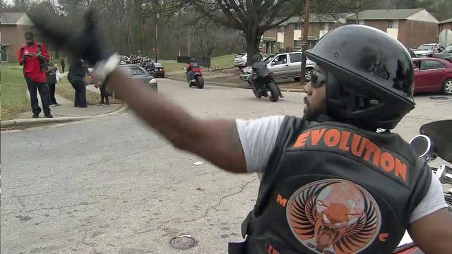 Motorcycle club rides through Raleigh bearing kids' gifts