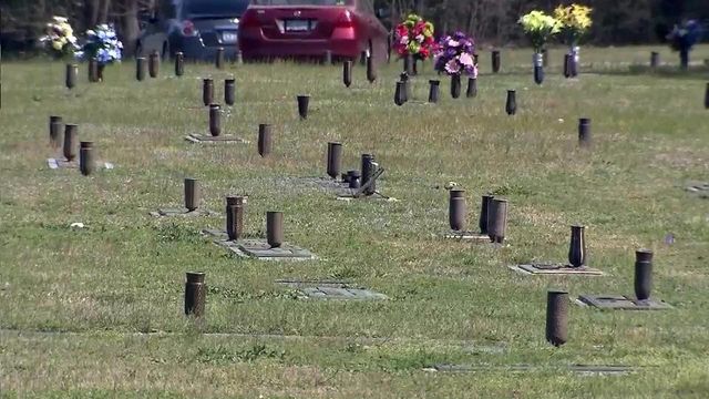 Cemetery manager apologizes for removal of flowers from graves