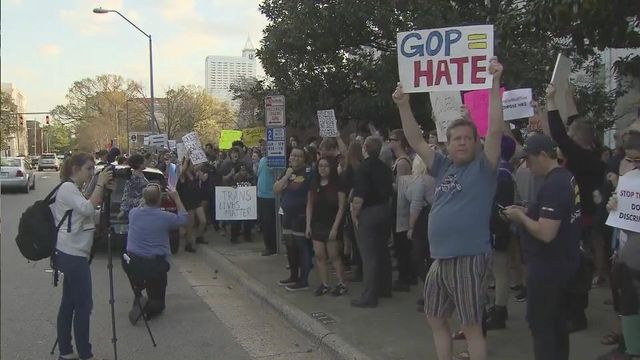 Protesters gather at governor's mansion