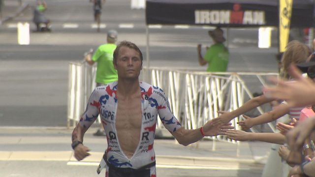 Athletes run, swim and cycle in Ironman triathlon