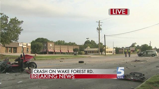 Two-vehicle wreck closes Wake Forest Road