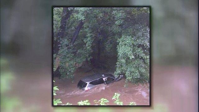 Two people rescued from car in creek