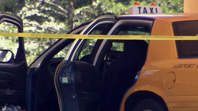 Police examine taxi at scene of fatal Durham shooting