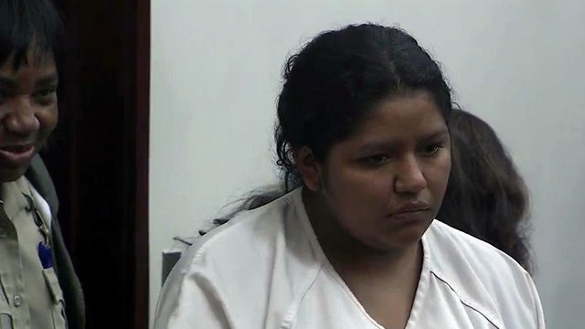 Authorities say woman charged in daughter's death a flight risk