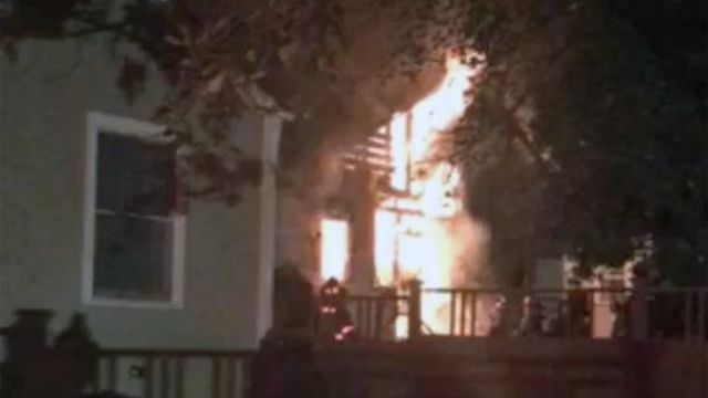 Fire rips through back of Durham home