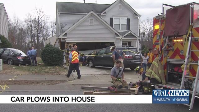 Woman taken to hospital after crashing car into 2 Raleigh homes