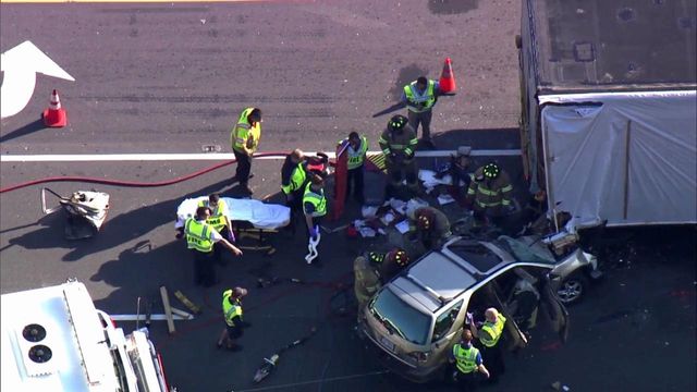 RAW: SUV pinned under truck carrying mobile home in Garner
