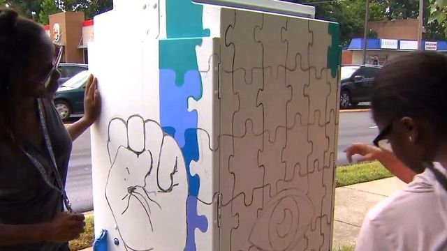 Teen artists beautify Durham with bright murals