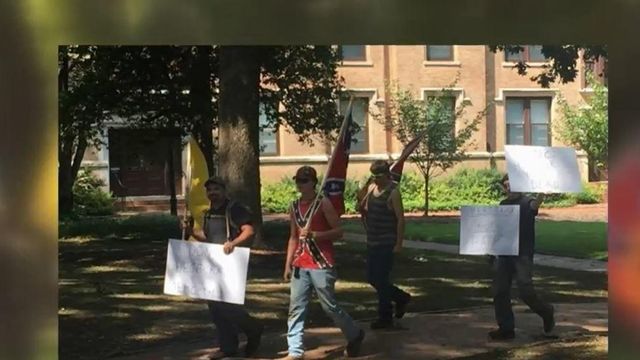 Demonstrators march with Confederate flags on UNC-Chapel Hill campus
