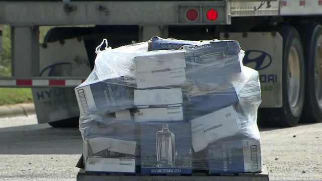 Crews remove 40,000 pints of vodka from overturned truck