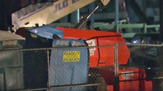 Construction worker injured when beam falls on portable toilet 