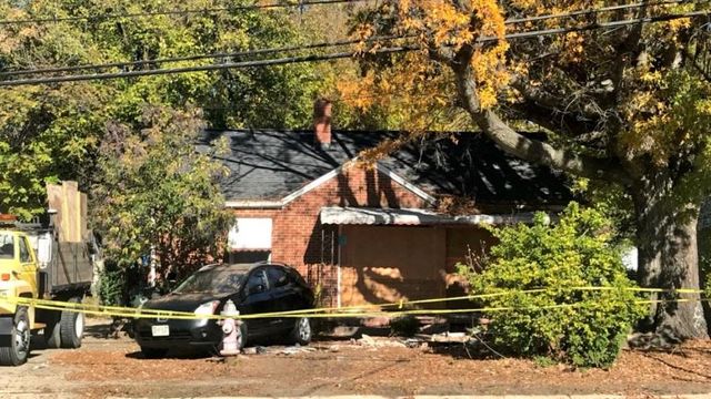 Neighbors shocked after car slams into Raleigh home, killing man