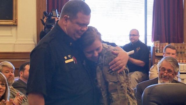 Raw: Tears fall as soldier surprises her 'daddy' in court
