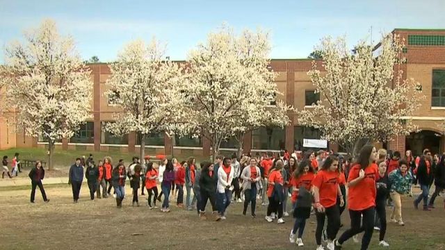 Chapel Hill students walk out of class, wear #Enough T-shirts