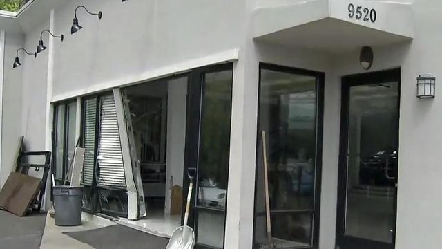 Witness describes moment woman drove car into Raleigh dealership
