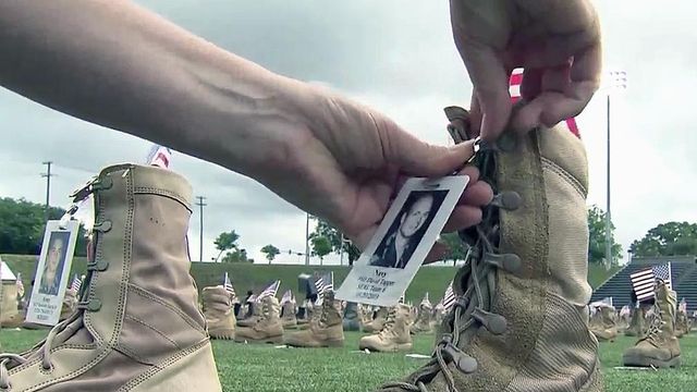 Boots laid out on Fort Bragg field honor fallen service members