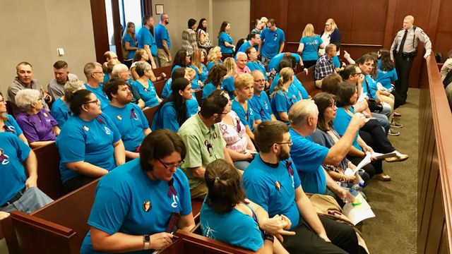 Blue shirts, raw emotion plentiful in plea hearing for woman's stabbing death