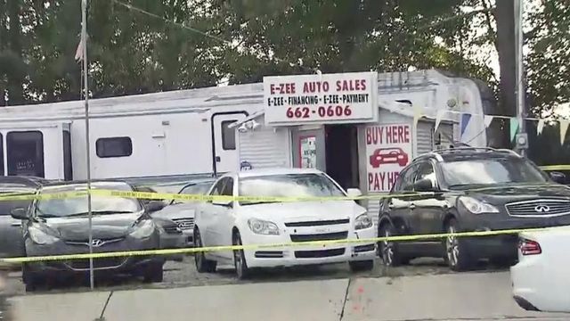 Employee shot during armed robbery at car dealership 