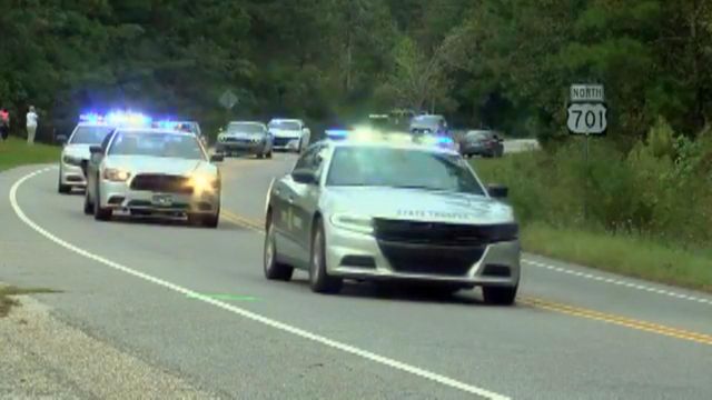 Law enforcement honors slain trooper with motorcade
