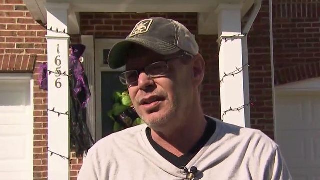 Man rescues neighbor's mother from townhouse fire