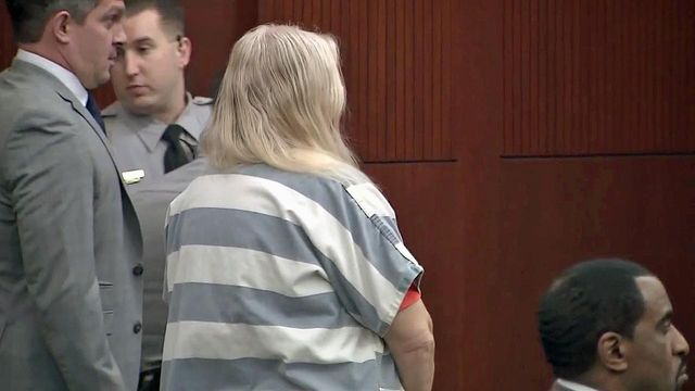 Woman charged in connection to dead horses appears in court