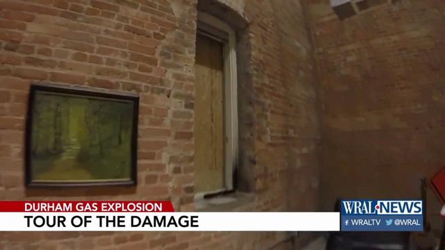 Boarded windows, damaged doors inside apartment across from Durham explosion